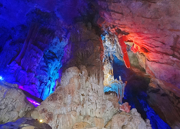 The illuminated cave looks like a fairyland.